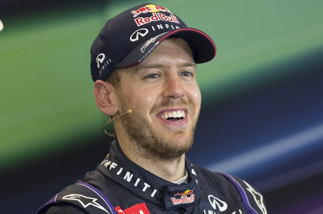 Nov 17, 2013; Austin, TX, USA; Formula One driver Sebastian Vettel (1) is interviewed after winning the United States Grand Prix at Circuit of the Americas. Mandatory Credit: Jerome Miron-USA TODAY Sports
