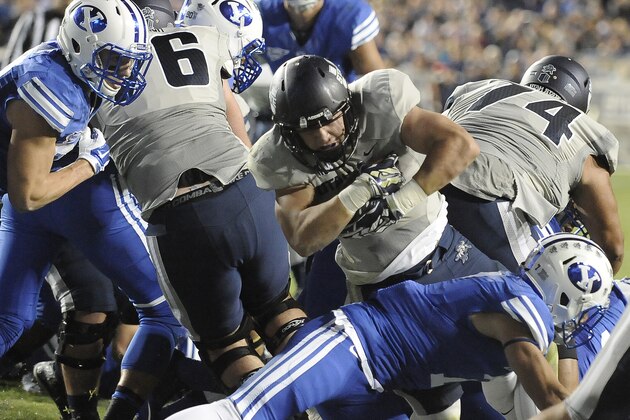 PROVO, UT - OCTOBER 3: Nick Vigil #41 of the Utah State Aggies lunges into the end zone for a third-quarter touchdown against the Brigham Young Cougars at LaVell Edwards Stadium on October 3, 2014 in Provo, Utah. (Photo by Gene Sweeney Jr/Getty Images )