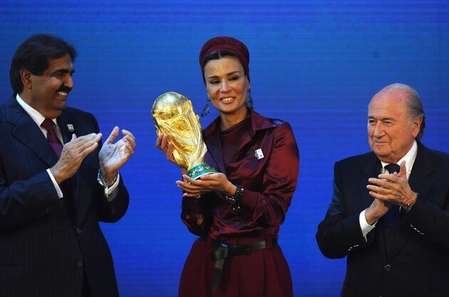 ZURICH, SWITZERLAND - DECEMBER 02:  The Emir State of Qatar HH Sheikh Hamad bin Khalifa Al-Thani and Sheikha Mozah bint Nasser Al Missned are presented with the World Cup Tophy by FIFA President Joseph S Blatter after winning the bid for 2022 during the FIFA World Cup 2018 & 2022 Host Countries Announcement at the Messe Conference Centre on December 2, 2010 in Zurich, Switzerland.  (Photo by Laurence Griffiths/Getty Images)