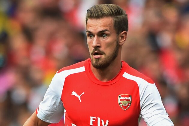 LONDON, ENGLAND - AUGUST 02:  Aaron Ramsey of Arsenal in action during the Emirates Cup match between Arsenal and Benfica at the Emirates Stadium on August 2, 2014 in London, England.  (Photo by Michael Regan/Getty Images)