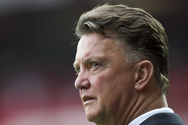 Manchester United's manager Louis van Gaal stands on the touchline before his team's English Premier League soccer match against Queens Park Rangers at Old Trafford Stadium, Manchester, England, Sunday Sept. 14, 2014. (AP Photo/Jon Super)