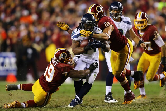 LANDOVER, MD - JANUARY 06:   Marshawn Lynch #24 of the Seattle Seahawks runs the ball against the Washington Redskins during the NFC Wild Card Playoff Game at FedExField on January 6, 2013 in Landover, Maryland.  (Photo by Al Bello/Getty Images)