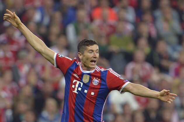 Bayern's Robert Lewandowski gestures during the Champions League group E soccer match between Bayern Munich and Manchester City in Munich, Germany, Wednesday Sept.17,2014. (AP Photo/Kerstin Joensson)