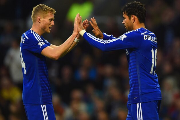 BURNLEY, ENGLAND - AUGUST 18:  Andre Schurrle of Chelsea congratulates Diego Costa of Chelsea on scoring their first goal during the Barclays Premier League match between Burnley and Chelsea at Turf Moor on August 18, 2014 in Burnley, England.  (Photo by Laurence Griffiths/Getty Images)