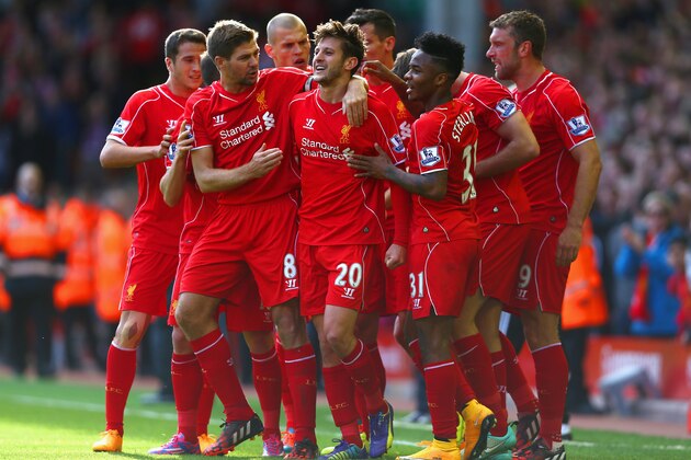 LIVERPOOL, ENGLAND - OCTOBER 04:  Adam Lallana of Liverpool is congratulated by team mates on scoring the opening goal during the Barclays Premier League match between Liverpool and West Bromwich Albion at Anfield on October 4, 2014 in Liverpool, England.  (Photo by Clive Brunskill/Getty Images)