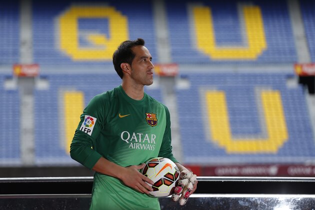Barcelona's new signing Chile's goalkeeper Claudio Bravo, pauses, during his official presentation as a new player for FC Barcelona at the Camp Nou stadium in Barcelona, Spain, Monday, July 7, 2014. (AP Photo/Emilio Morenatti)