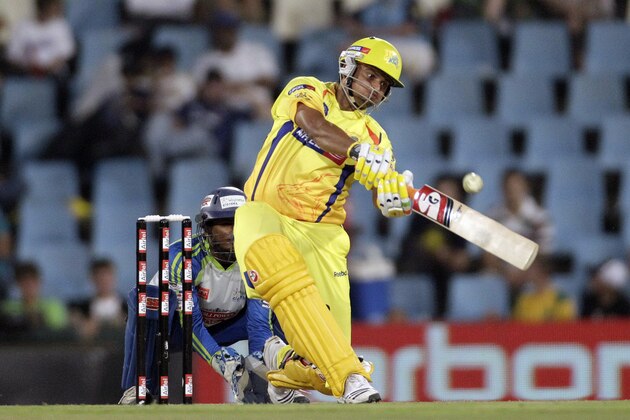 Chennai Super Kings batsman Suresh Raina, right, plays a stroke shot as Wayamba's wicketkeeper Kushal Janith Perera, left, looks on during the Champions League Twenty20 cricket match at the Supersport Park in Pretoria, South Africa on Wednesday Sept. 15, 2010. (AP Photo/Themba Hadebe)