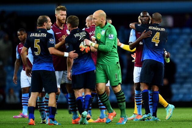 BIRMINGHAM, ENGLAND - OCTOBER 04:  Christian Benteke of Aston Villa is consoled by Vincent Kompany of Manchester City following the Barclays Premier League match between Aston Villa and Manchester City at Villa Park on October 4, 2014 in Birmingham, England.  (Photo by Shaun Botterill/Getty Images)