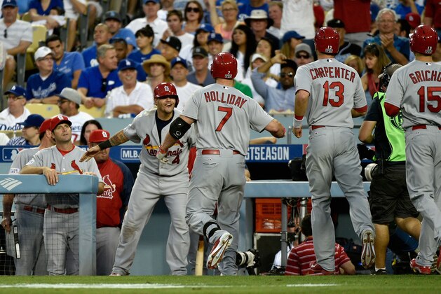 LOS ANGELES, CA - OCTOBER 03:  Matt Holliday #7 of the St. Louis Cardinals celebrates his three run homerun with teammates in the seventh inning during Game One of the National League Division Series against the Los Angeles Dodgers at Dodger Stadium on October 3, 2014 in Los Angeles, California.  (Photo by Kevork Djansezian/Getty Images)