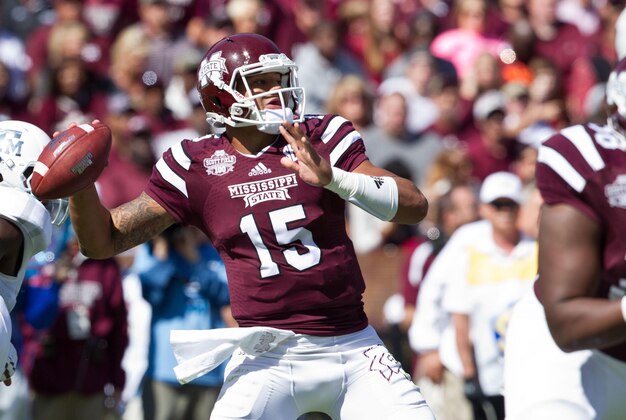 Oct 4, 2014; Starkville, MS, USA; Mississippi State Bulldogs quarterback Dak Prescott (15) throws the ball against the Texas A&M Aggies at Davis Wade Stadium. Mandatory Credit: Marvin Gentry-USA TODAY Sports