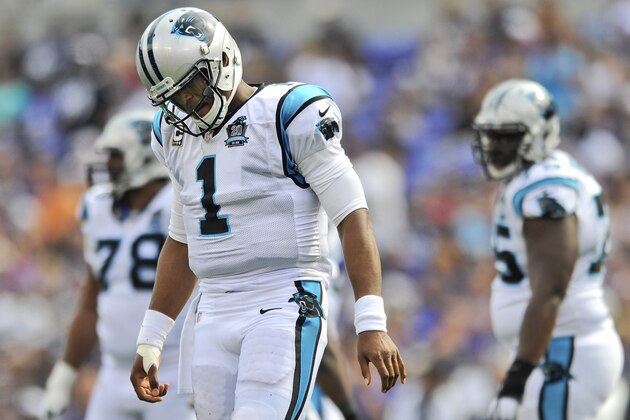 Carolina Panthers quarterback Cam Newton (1) walks off the field during the second half of an NFL football game against the Baltimore Ravens in Baltimore, Sunday, Sept. 28, 2014. (AP Photo/Gail Burton)