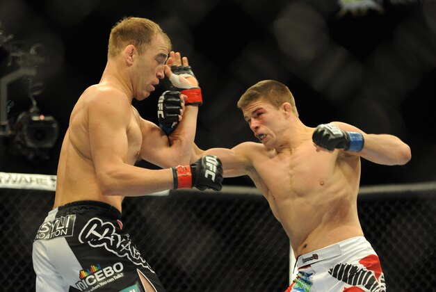Nov 16, 2013; Las Vegas, NV, USA; Brian Ebersole (red gloves) fights against Rick Story (blue gloves) in their welterweight bout during UFC 167 at MGM Grand Garden Arena. Mandatory Credit: Stephen R. Sylvanie-USA TODAY Sports