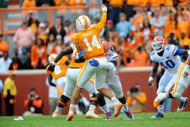 Oct 4, 2014; Knoxville, TN, USA; Florida Gators defensive lineman Brian Cox Jr. pressures Tennessee Volunteers quarterback Justin Worley (14) during the second half at Neyland Stadium. Florida won 10 to 9 Mandatory Credit: Randy Sartin-USA TODAY Sports