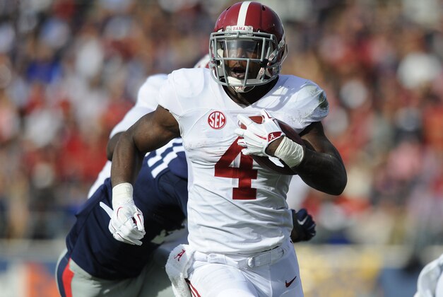 Oct 4, 2014; Oxford, MS, USA; Alabama Crimson Tide running back T.J. Yeldon (4) runs for a first down during the first half against Mississippi Rebels at Vaught-Hemingway Stadium. Mandatory Credit: Christopher Hanewinckel-USA TODAY Sports Oct 4, 2014; Oxford, MS, USA; Alabama Crimson Tide running back T.J. Yeldon (4) runs for a first down during the first half against Mississippi Rebels at Vaught-Hemingway Stadium. Mandatory Credit: Christopher Hanewinckel-USA TODAY Sports