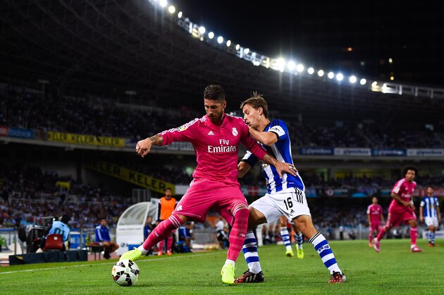 SAN SEBASTIAN, SPAIN - AUGUST 31:  Sergio Ramos of Real Madrid CF competes for the ball with Sergio Canales of Real Sociedad during the La Liga match between Real Sociedad de Futbol and Real Madrid CF at Estadio Anoeta on August 31, 2014 in San Sebastian, Spain.  (Photo by David Ramos/Getty Images)