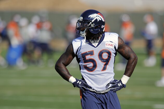Denver Broncos outside linebacker Danny Trevathan takes a break during a drill at an NFL training camp in Englewood, Colo., on Saturday, Aug. 9, 2014. (AP Photo/Chris Schneider)