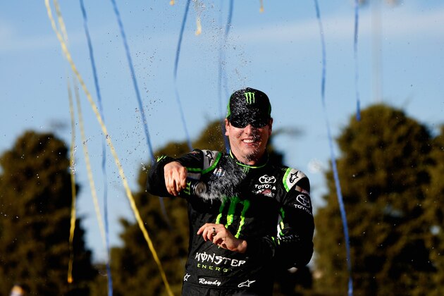 KANSAS CITY, KS - OCTOBER 04:  Kyle Busch, driver of the #54 Monster Energy Toyota, celebrates in victory lane after winning the NASCAR Nationwide Series Kansas Lottery 300 at Kansas Speedway on October 4, 2014 in Kansas City, Kansas.  (Photo by Sean Gardner/Getty Images)