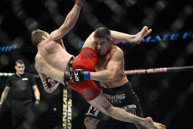 Rick Story, right, of USA fights Gunnar Nelson of Iceland in a welterweight Mixed Martial Arts bout during the Ultimate Fighting Championship (UFC) gala at the Globe Arena in Stockholm, Sweden, on Saturday Oct. 4, 2014. In a surprise result against current form, Story went on to defeat Nelson. (AP Photo / TT, Anders Wiklund)  SWEDEN OUT