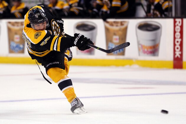 BOSTON, MA - MARCH 01:  Johnny Boychuk #55 of the Boston Bruins takes a shot against the Washington Capitals during a game at the TD Garden on March 1, 2014 in Boston, Massachusetts.  (Photo by Alex Trautwig/Getty Images)