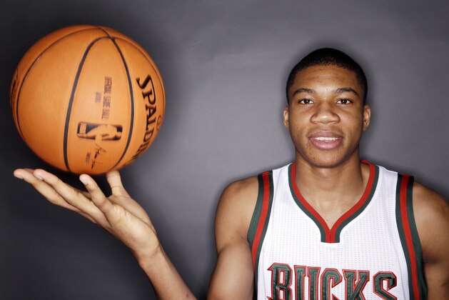 Milwaukee Bucks' Giannis Antetokounmpo poses for a picture during the team's media day Monday, Sept. 29, 2014, in St. Francis, Wis. (AP Photo/Morry Gash)