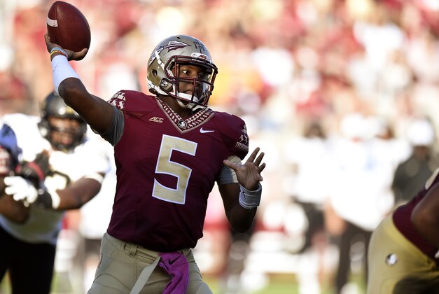 Oct 4, 2014; Tallahassee, FL, USA; Florida State Seminoles quarterback Jameis Winston (5) drops back to pass against the Wake Forest Demon Deacons during the fourth quarter at Doak Campbell Stadium. Florida State Seminoles defeated the Wake Forest Demon Deacons 43-3. Mandatory Credit: John David Mercer-USA TODAY Sports