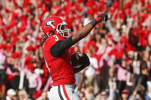 Georgia running back Todd Gurley (3) reacts after rushing for  a touchdown in the first half of an NCAA college football game against Vanderbilt  Saturday, Oct. 4, 2014, in Athens, Ga.  (AP Photo/John Bazemore)