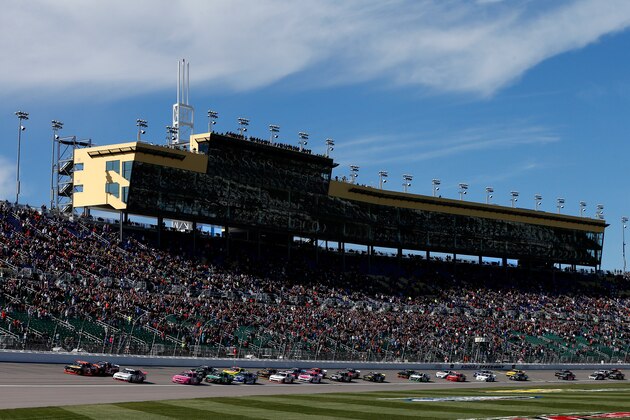 KANSAS CITY, KS - OCTOBER 04:  Ty Dillon, driver of the #3 Bass Pro Shops Chevrolet, Ryan Blaney, driver of the #22 Discount Tire Ford, and Kevin Harvick, driver of the #5 Morton Buildings Chevrolet,  lead the field at the start during the NASCAR Nationwide Series Kansas Lottery 300 at Kansas Speedway on October 4, 2014 in Kansas City, Kansas.  (Photo by Sean Gardner/Getty Images)