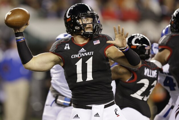 Cincinnati quarterback Gunner Kiel passes against Memphis in the first half of an NCAA college football game, Saturday, Oct. 4, 2014, in Cincinnati. (AP Photo/Al Behrman)