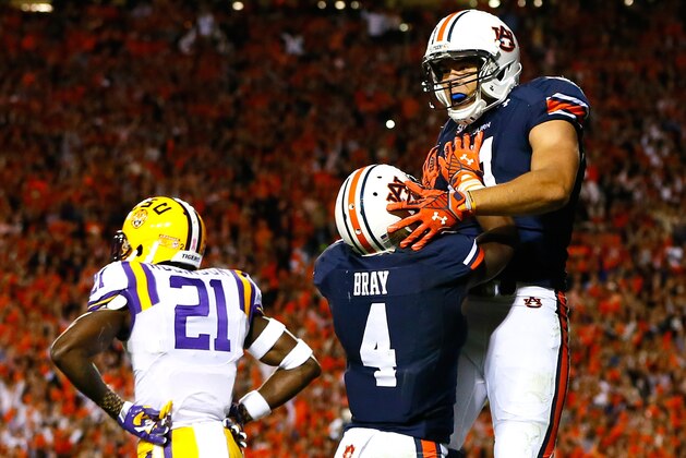 AUBURN, AL - OCTOBER 04:  C.J. Uzomah #81 of the Auburn Tigers celebrates a touchdown reception against Rashard Robinson #21 of the LSU Tigers with Quan Bray #4 at Jordan Hare Stadium on October 4, 2014 in Auburn, Alabama.  (Photo by Kevin C. Cox/Getty Images)