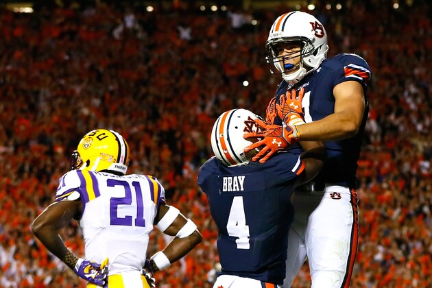 AUBURN, AL - OCTOBER 04:  C.J. Uzomah #81 of the Auburn Tigers celebrates a touchdown reception against Rashard Robinson #21 of the LSU Tigers with Quan Bray #4 at Jordan Hare Stadium on October 4, 2014 in Auburn, Alabama.  (Photo by Kevin C. Cox/Getty Images)