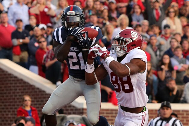 OXFORD, MS - OCTOBER 4: Senquez Golson #21 of the Ole Miss Rebels intercepts a pass attempt in the endzone against O.J. Howard #88 of the Alabama Crimson Tide on OCTOBER 4, 2014 at Vaught-Hemingway Stadium in Oxford, Mississippi. Mississippi beat Alabama 23-17. (Photo by Joe Murphy/Getty Images)