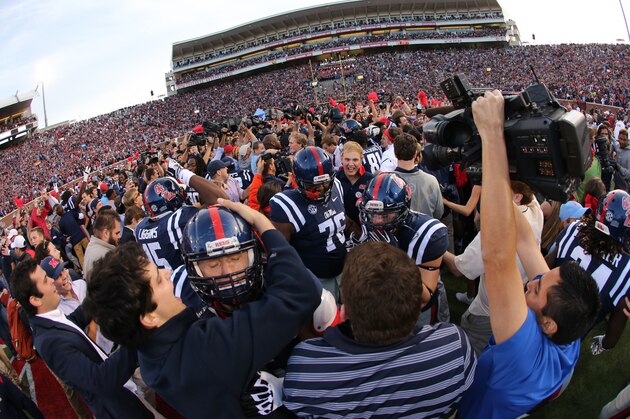 OXFORD, MS - OCTOBER 4: Fans of the Ole Miss Rebels rush the field to celebrate the victory over the Alabama Crimson Tide on OCTOBER 4, 2014 at Vaught-Hemingway Stadium in Oxford, Mississippi. Mississippi beat Alabama 23-17. (Photo by Joe Murphy/Getty Images)