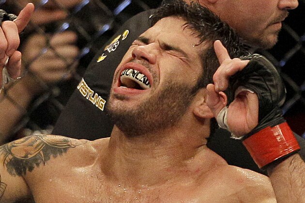 Raphael Assuncao celebrates after beating Mike Easton during a bantamweight mixed martial arts bout at a UFC on Fox event in Seattle, Saturday, Dec. 8, 2012. (AP Photo/Jeff Chiu)
