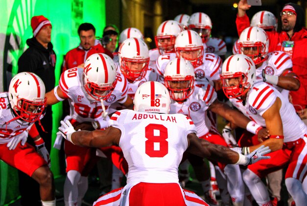 Oct 4, 2014; East Lansing, MI, USA; Nebraska Cornhuskers running back Ameer Abdullah (8) brings the Nebraska Cornhuskers on to the field prior to a game at Spartan Stadium. Mandatory Credit: Mike Carter-USA TODAY Sports