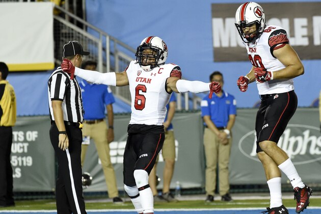 PASADENA, CA - OCTOBER 04: Wide receiver Des Anderson #6 of the Utah Utes celebrate his touchdown with teammate Westlee Tonga #80 against the UCLA Bruins during the first half at the Rose Bowl October 04, 2014, in Pasadena, California. (Photo by Kevork Djansezian/Getty Images)