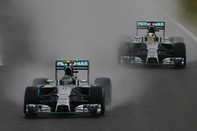Mercedes driver Nico Rosberg of Germany, left, leads Mercedes driver Lewis Hamilton of Britain at Japanese Formula One Grand Prix at the Suzuka Circuit in Suzuka, central Japan, Sunday, Oct. 5, 2014.(AP Photo/Shuji Kajiyama)