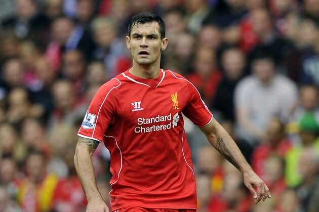 Liverpool's Dejan Lovren in action during their English Premier League soccer match against Everton at Anfield in Liverpool, England, Saturday Sept. 27, 2014. (AP Photo/Clint Hughes)