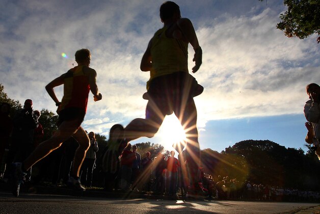 Elite Runners race around Lake Harriett during the Medtronic Twin Cities Marathon in Minneapolis, Sunday, Oct. 6, 2013. (AP Photo/Andy Clayton-King)