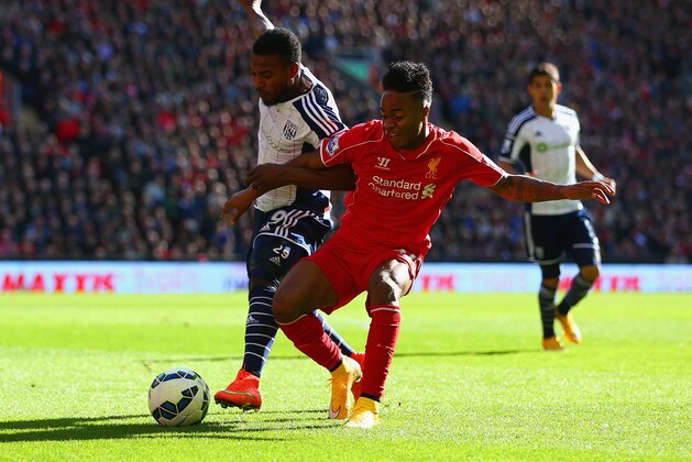 LIVERPOOL, ENGLAND - OCTOBER 04:  Raheem Sterling of Liverpool and Stephane Sessegnon of West Brom fight for the ball during the Barclays Premier League match between Liverpool and West Bromwich Albion at Anfield on October 4, 2014 in Liverpool, England.  (Photo by Clive Brunskill/Getty Images)