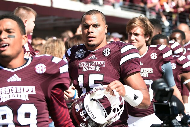 STARKVILLE, MS - OCTOBER 04:  Dak Prescott #15 of the Mississippi State Bulldogs celebrates with fans following a game against the Texas A&M Aggies at Davis Wade Stadium on October 4, 2014 in Starkville, Mississippi.  Mississippi State won the game 48-31.  (Photo by Stacy Revere/Getty Images)