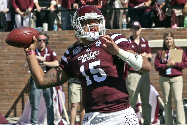 Mississippi State quarterback Dak Prescott (15) throws a pass during the second half of an NCAA college football game against Texas A&M in Starkville, Miss., Saturday, Oct. 4, 2014. MSU won 48-31. (AP Photo/Jim Lytle)