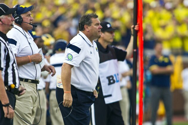Michigan head coach Brady Hoke watches game action from the sidelines in the third quarter of an NCAA college football game against Minnesota in Ann Arbor, Mich., Saturday, Sept. 27, 2014. Minnesota won 30-14. (AP Photo/Tony Ding)