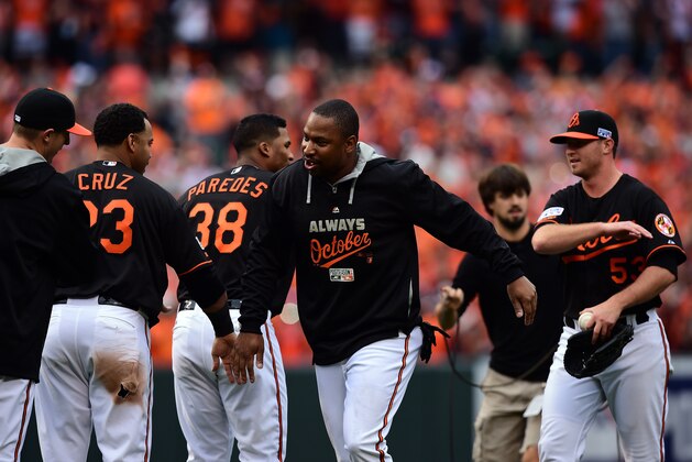 BALTIMORE, MD - OCTOBER 03:  Delmon Young #27 of the Baltimore Orioles celebrates with teammate Nelson Cruz #23 after defeating the Detroit Tigers 7 - 6 in Game Two of the American League Division Series at Oriole Park at Camden Yards on October 3, 2014 in Baltimore, Maryland.  (Photo by Patrick Smith/Getty Images)