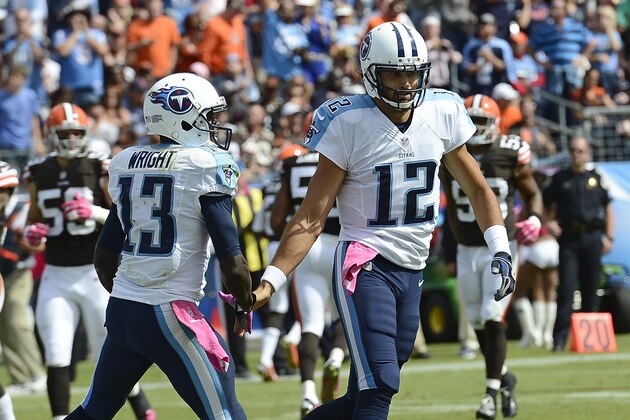 Tennessee Titans wide receiver Kendall Wright (13) celebrates with quarterback Charlie Whitehurst, right, after Wright scored a touchdown against the Cleveland Browns on an 11-yard pass in the second quarter of an NFL football game Sunday, Oct. 5, 2014, in Nashville, Tenn. (AP Photo/Mark Zaleski)