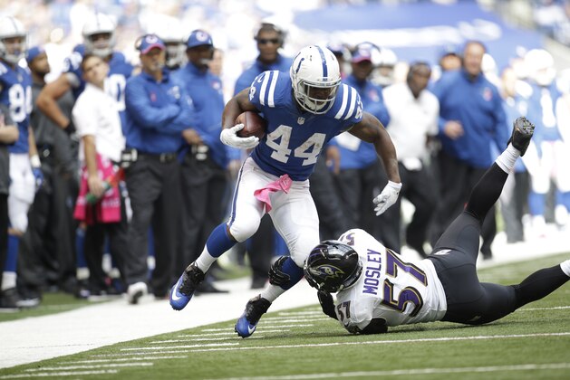 Indianapolis Colts running back Ahmad Bradshaw (44) is tackled by Baltimore Ravens inside linebacker C.J. Mosley during the first half of an NFL football game in Indianapolis, Sunday, Oct. 5, 2014. (AP Photo/AJ Mast)