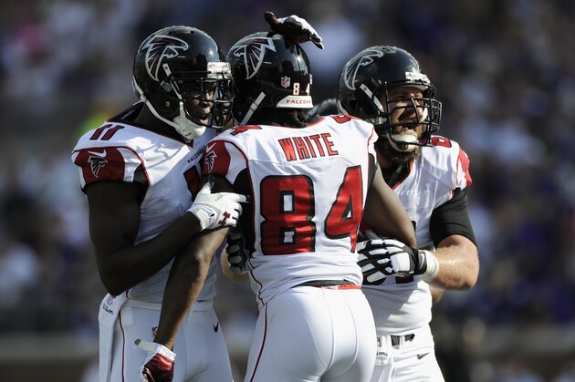 MINNEAPOLIS, MN - SEPTEMBER 28: Julio Jones #11 and Joe Hawley #61 of the Atlanta Falcons congratulate teammate Roddy White #84 on a touchdown against the Minnesota Vikings during the first quarter of the game on September 28, 2014 at TCF Bank Stadium in Minneapolis, Minnesota. (Photo by Hannah Foslien/Getty Images)