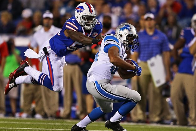 ORCHARD PARK, NY - AUGUST 28:   George Winn #38 of the Detroit Lions is brought down from behind by Nigel Bradham #53 of the Buffalo Bills during the first half of a preseason game at Ralph Wilson Stadium on August 28, 2014 in Orchard Park, New York.  (Photo by Vaughn Ridley/Getty Images)