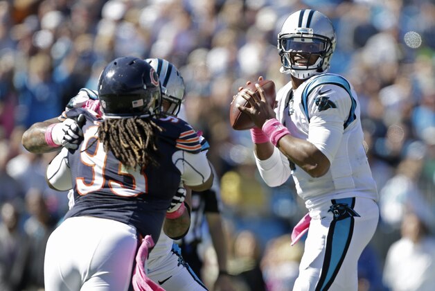 Carolina Panthers' Cam Newton (1) looks to pass against the Chicago Bears during the first half of an NFL football game in Charlotte, N.C., Sunday, Oct. 5, 2014. (AP Photo/Bob Leverone)