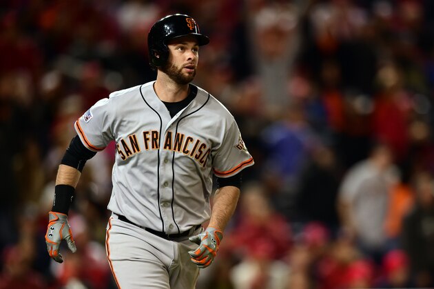 WASHINGTON, DC - OCTOBER 04:  Brandon Belt #9 of the San Francisco Giants runs the bases after hitting a solo home run to right field in the eighteenth inning against Tanner Roark #57 of the Washington Nationals during Game Two of the National League Division Series at Nationals Park on October 4, 2014 in Washington, DC.  (Photo by Patrick Smith/Getty Images)