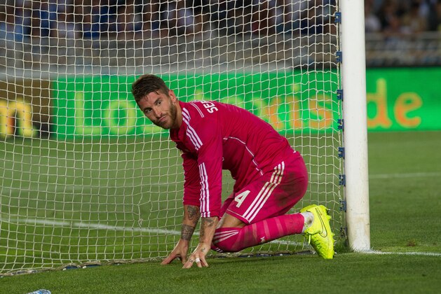 Real Madrid's Sergio Ramos reacts on the goal line during a Spanish La Liga soccer match between Real Madrid and Real Sociedad at the Anoeta stadium in San Sebastian, Spain, Sunday, Aug. 31, 2014. (AP Photo/Jose Ignacio Unanue)